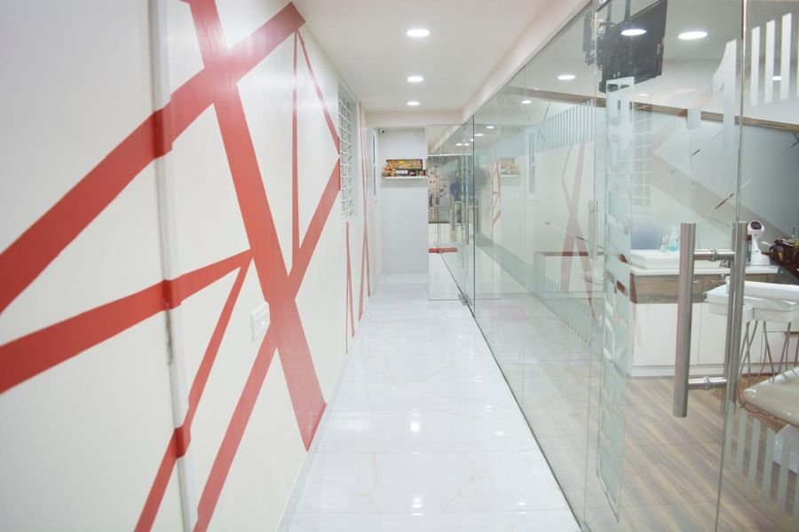 Bright corridor with glass-walled treatment rooms